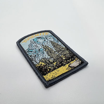 Merrowedのボーダーが付いている編まれたパッチの注文のジャケット パッチの支持の鉄